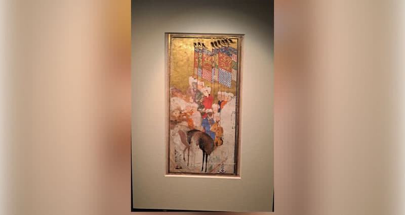 An image depicting banners inscribed with the name of Mirzo Ulughbek